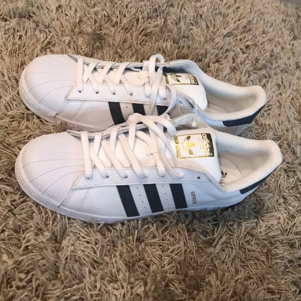 Size 13 Adidas Superstar White with Gray stripes.
